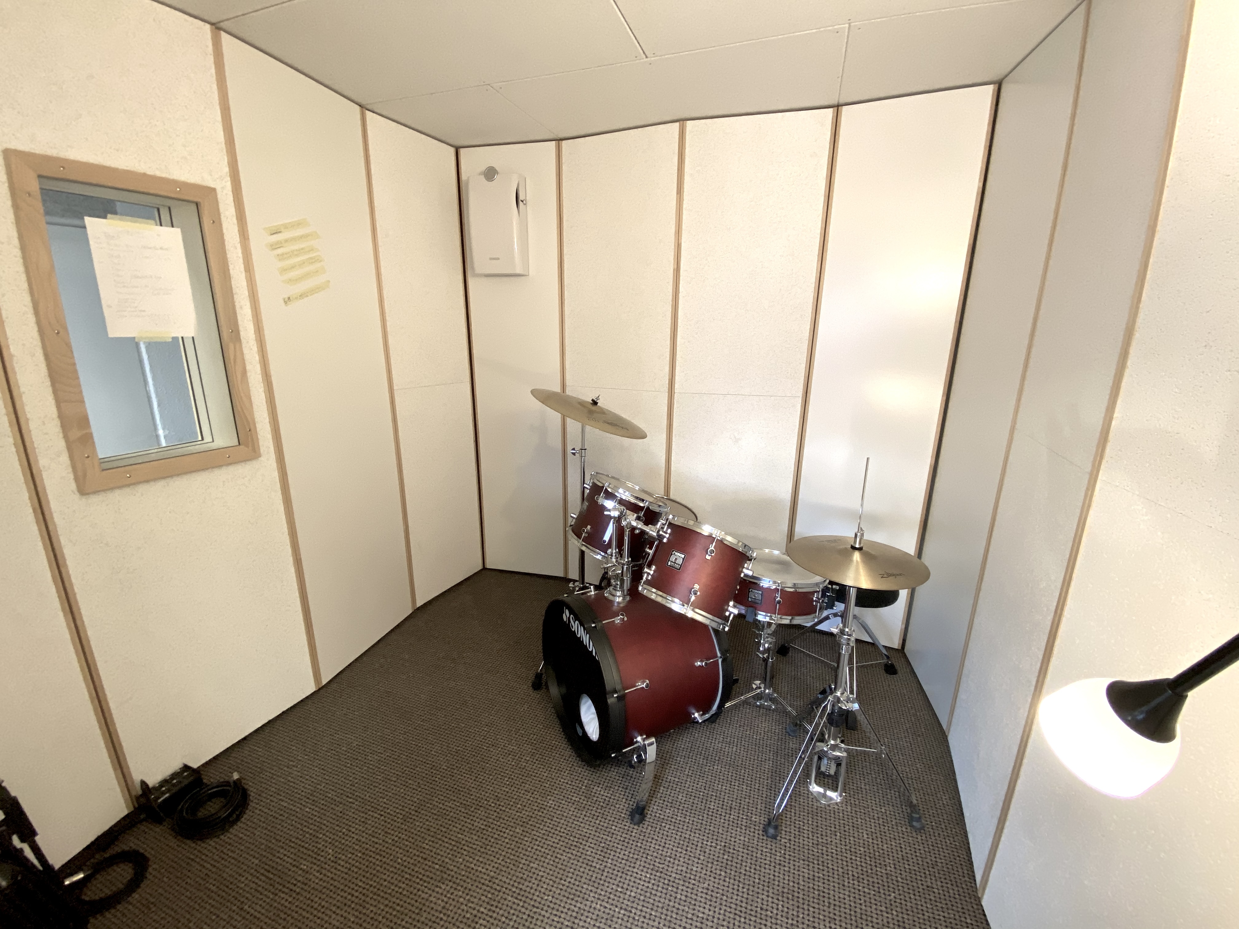 People at a concert facing the stage with various colours of paint powder in the air
